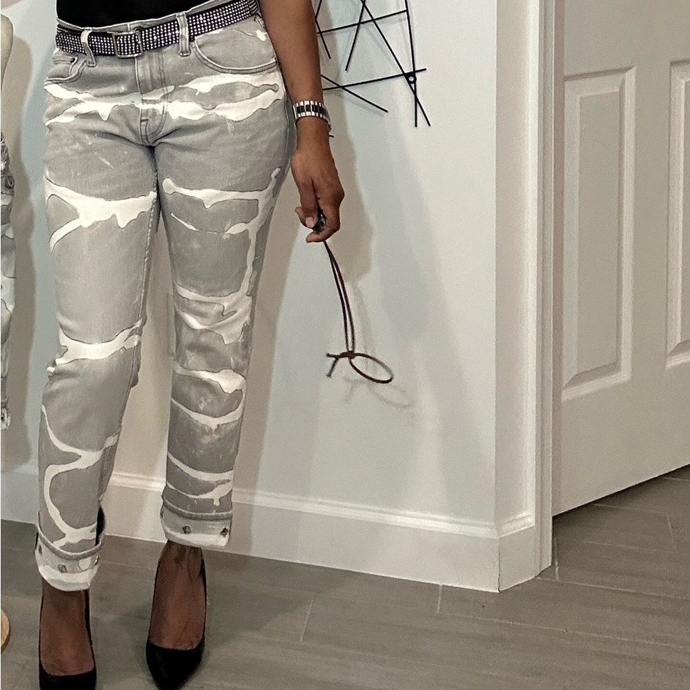 Custom bleached painted riveted jeans